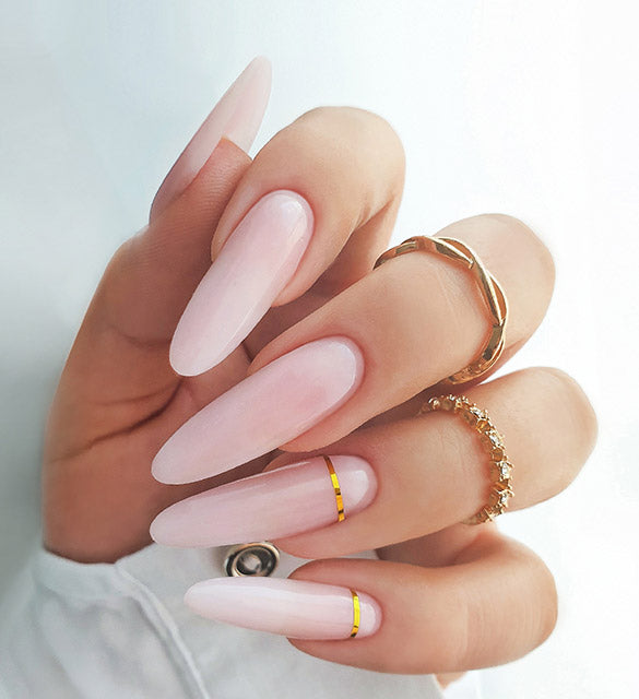 Subtle manicure with golden decoration