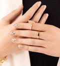 Delicate nails styling adorned with a top coat with black specks