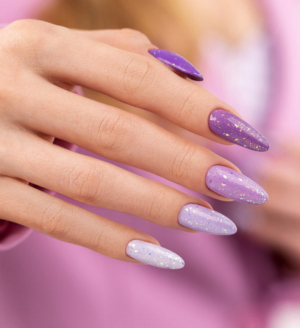 Purple nails styling with golden specks