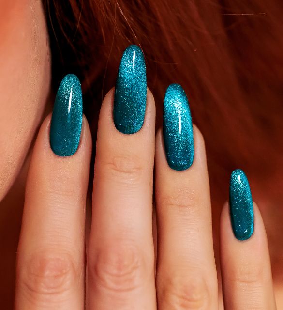Cyber turquoise nails with cat-eye effect