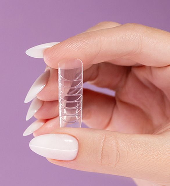 Milky white manicure shimmering with multicolored specks