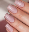 Subtle peach-beige manicure with shimmering silver