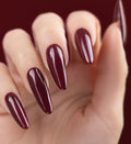 Shimmering volcanic burgundy manicure