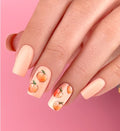 Pastel manicure with juicy peach